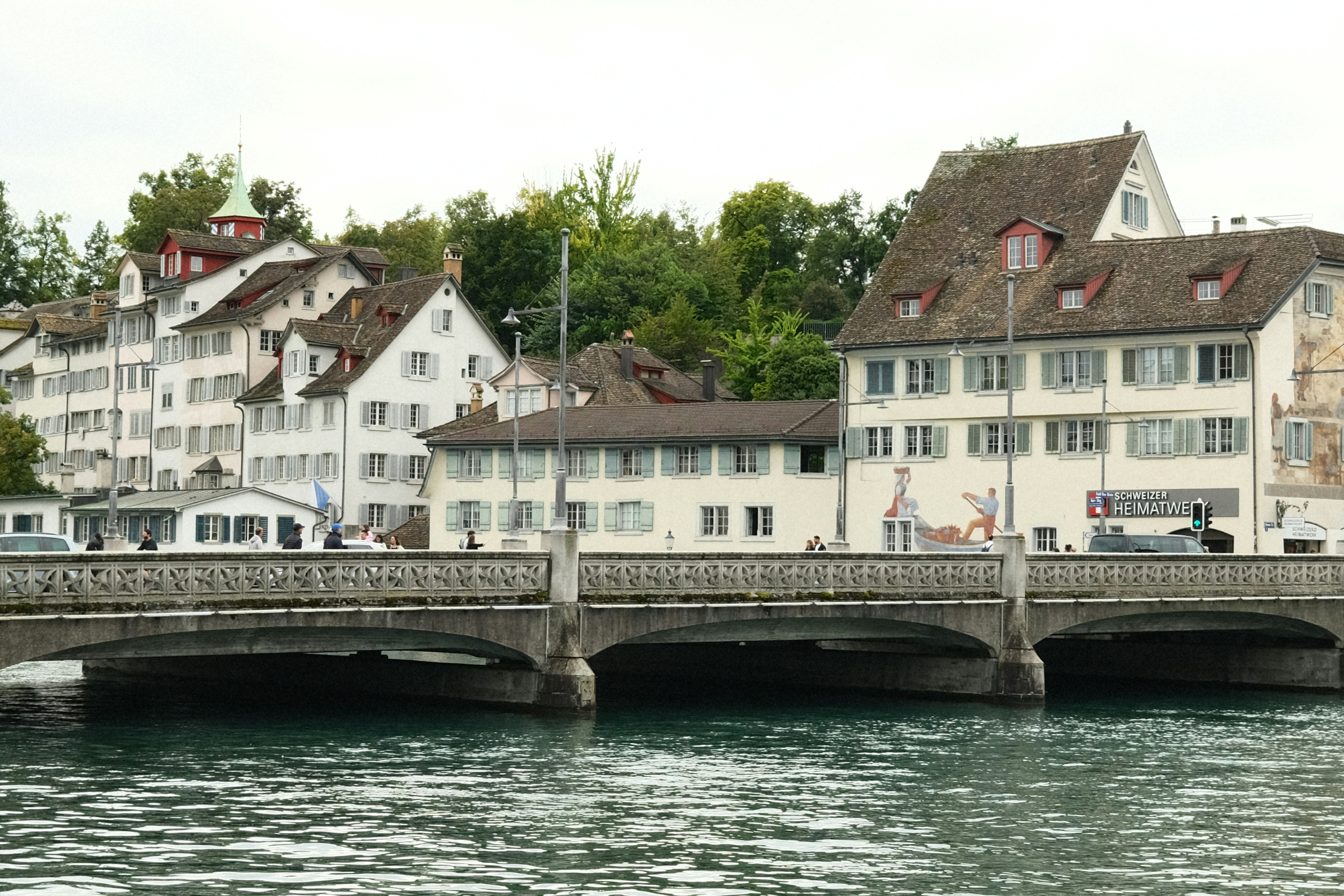 A bridge over a body of water next to buildings