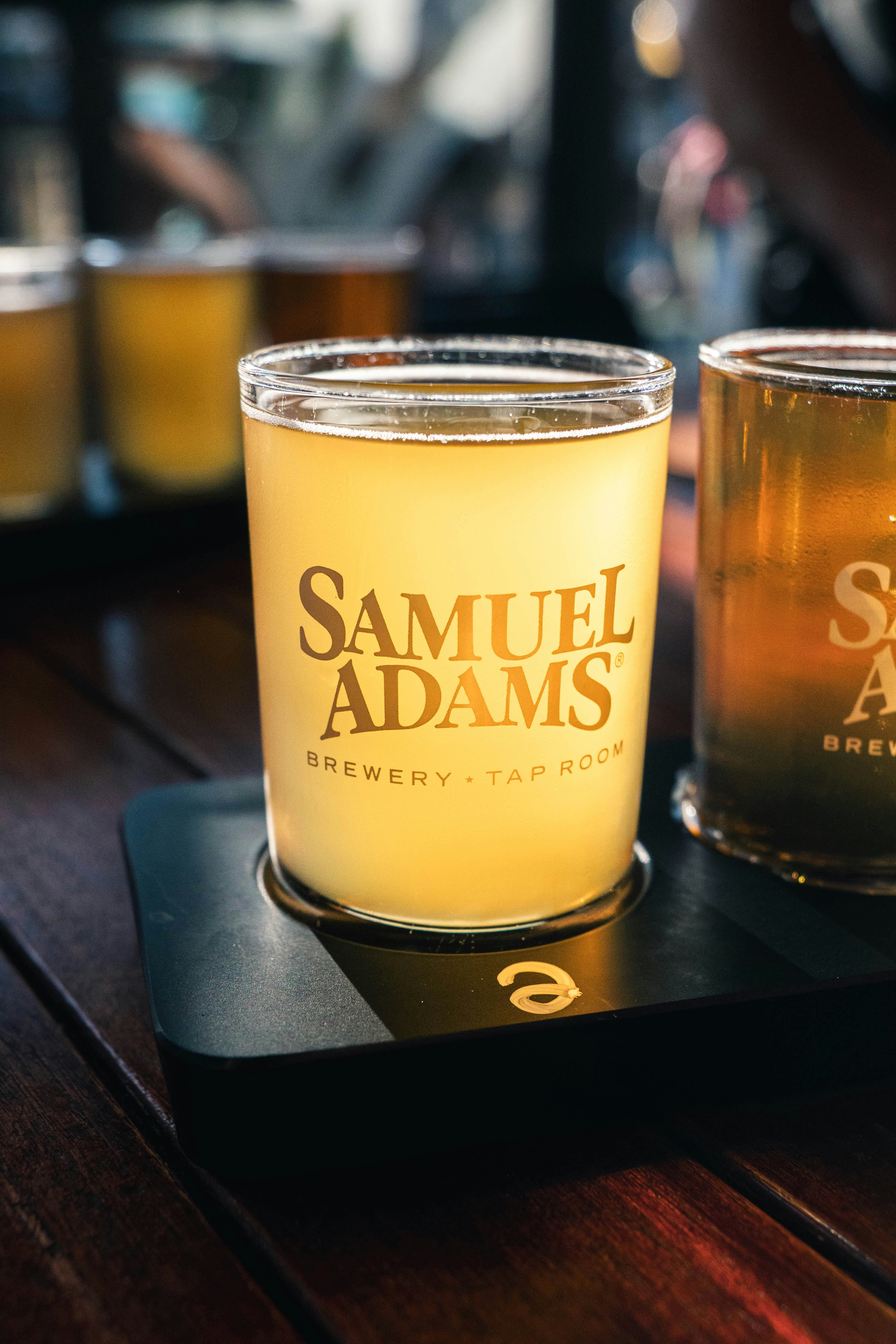 A couple of candles sitting on top of a wooden table