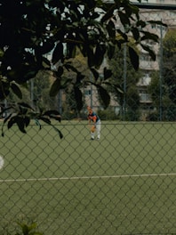A group of people playing a game of soccer