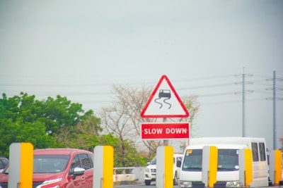 A row of cars parked in a parking lot