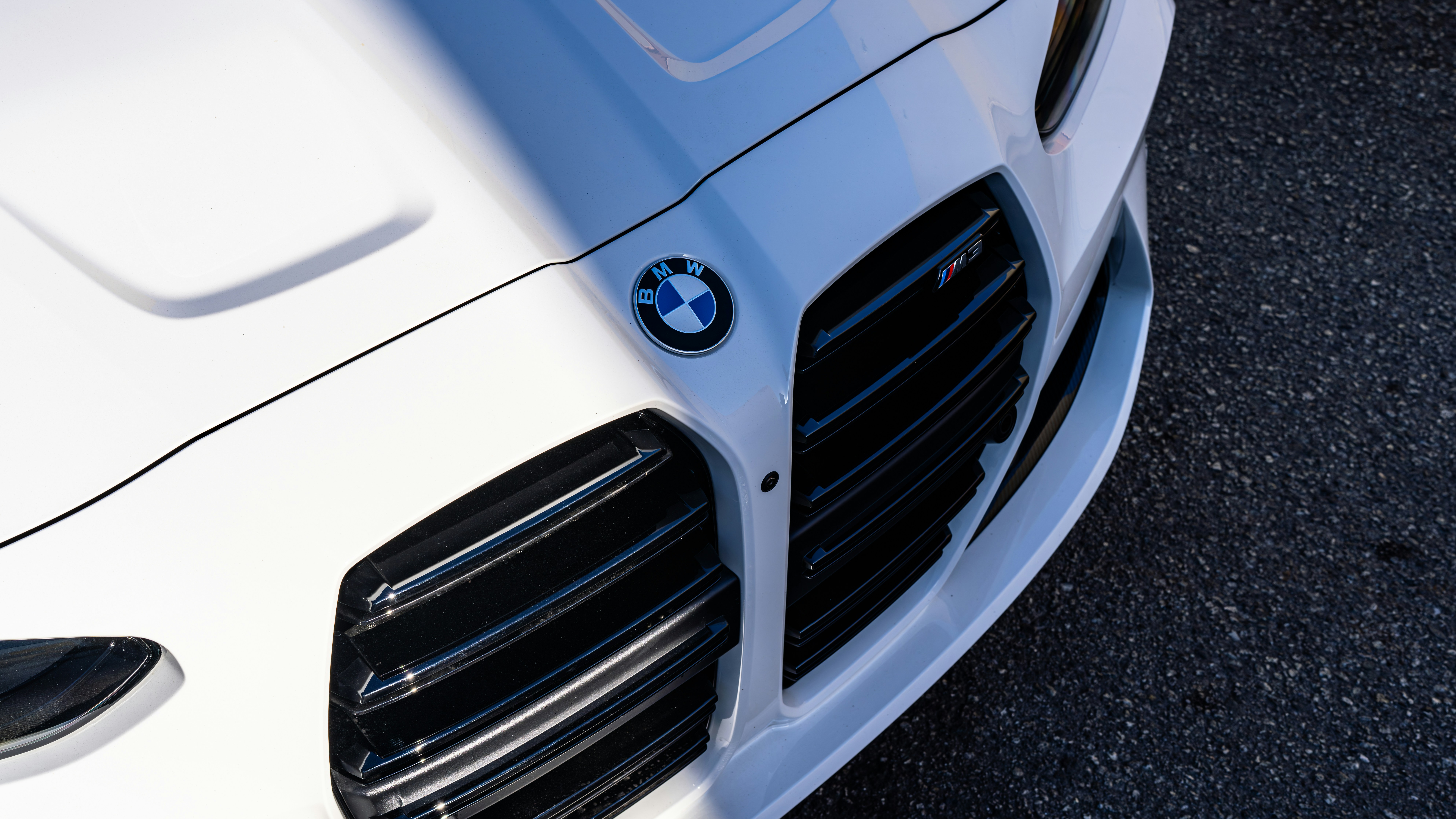 A close up of the front of a white car