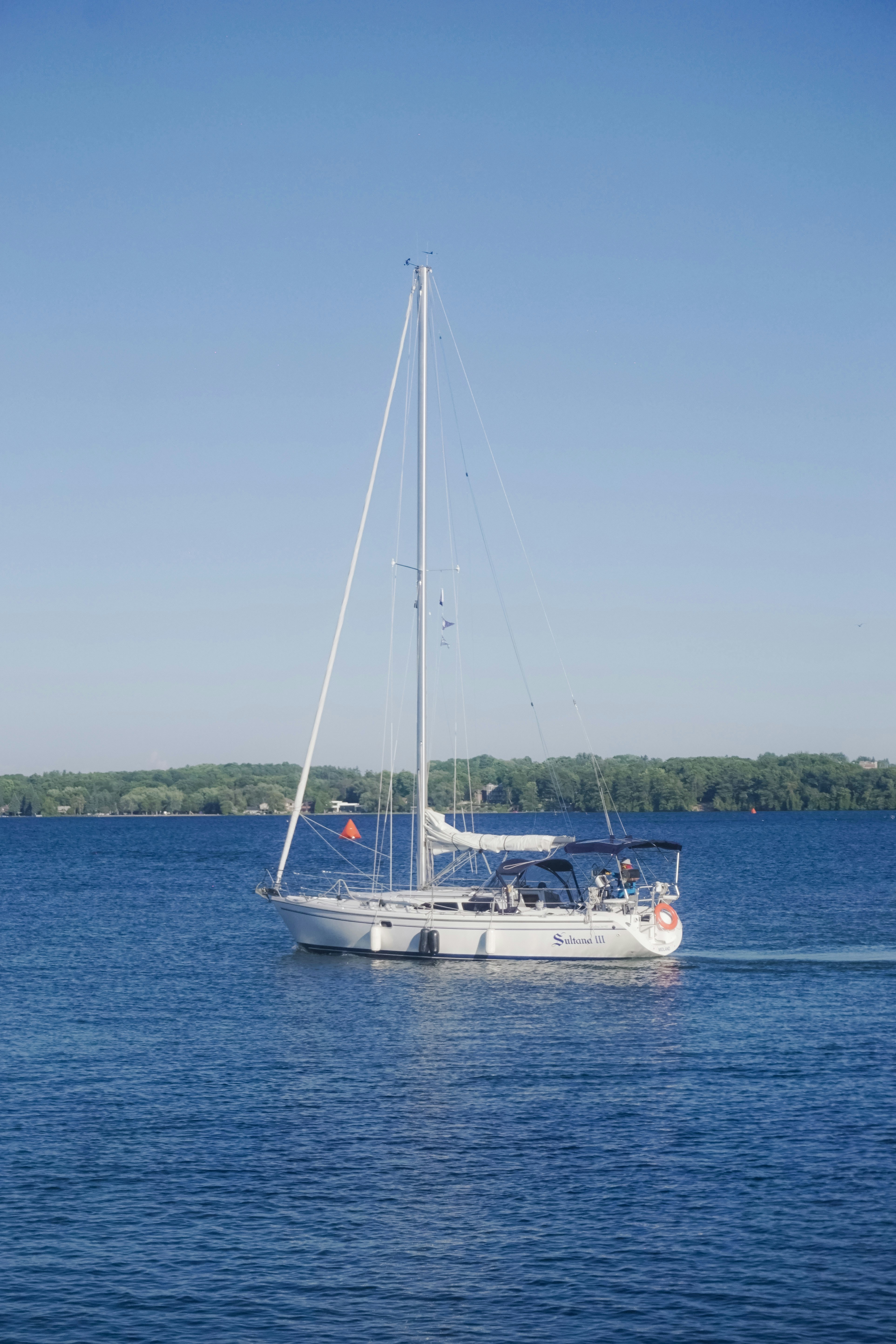 A sailboat sailing across a large body of water