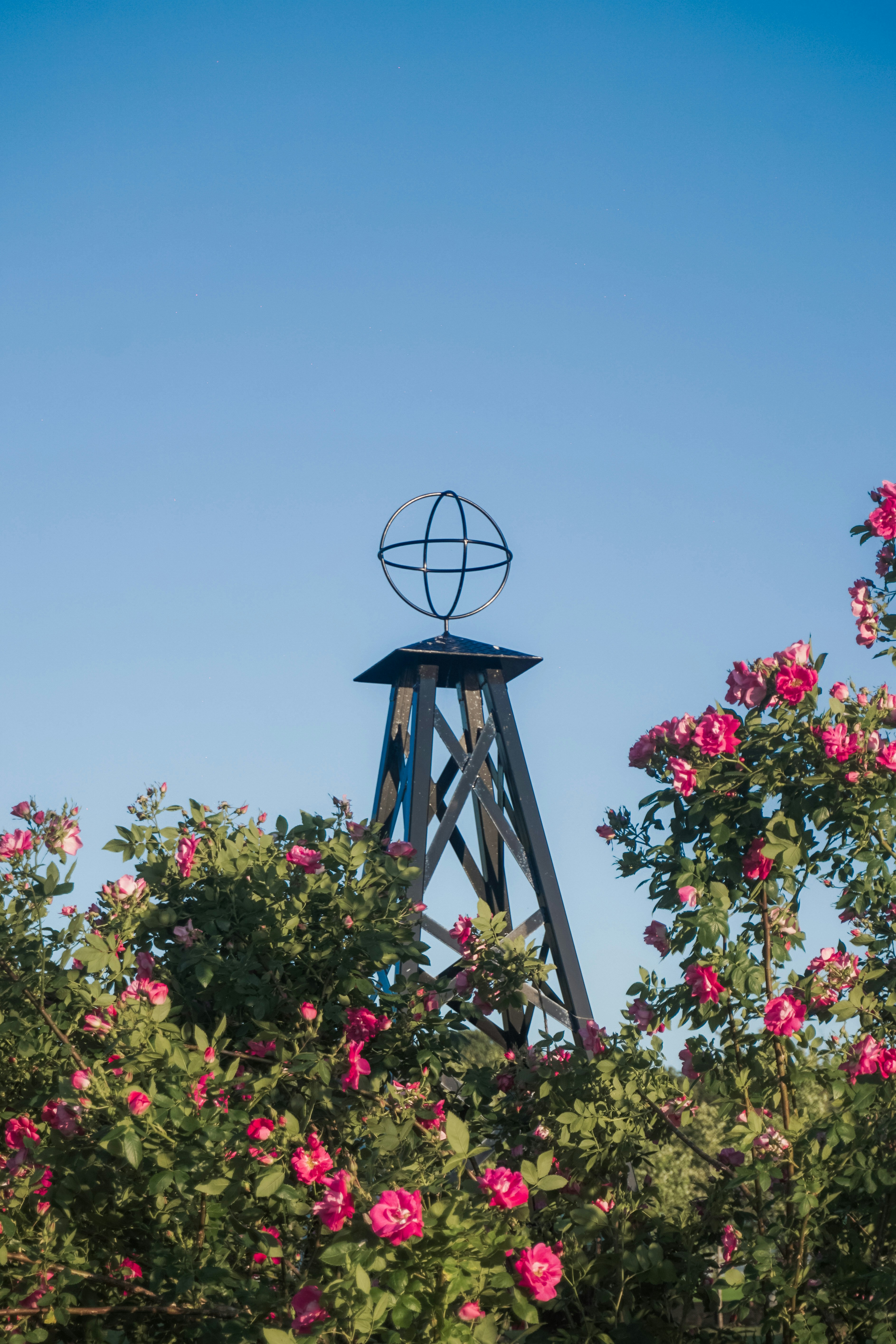 A tower with a wind indicator on top of it