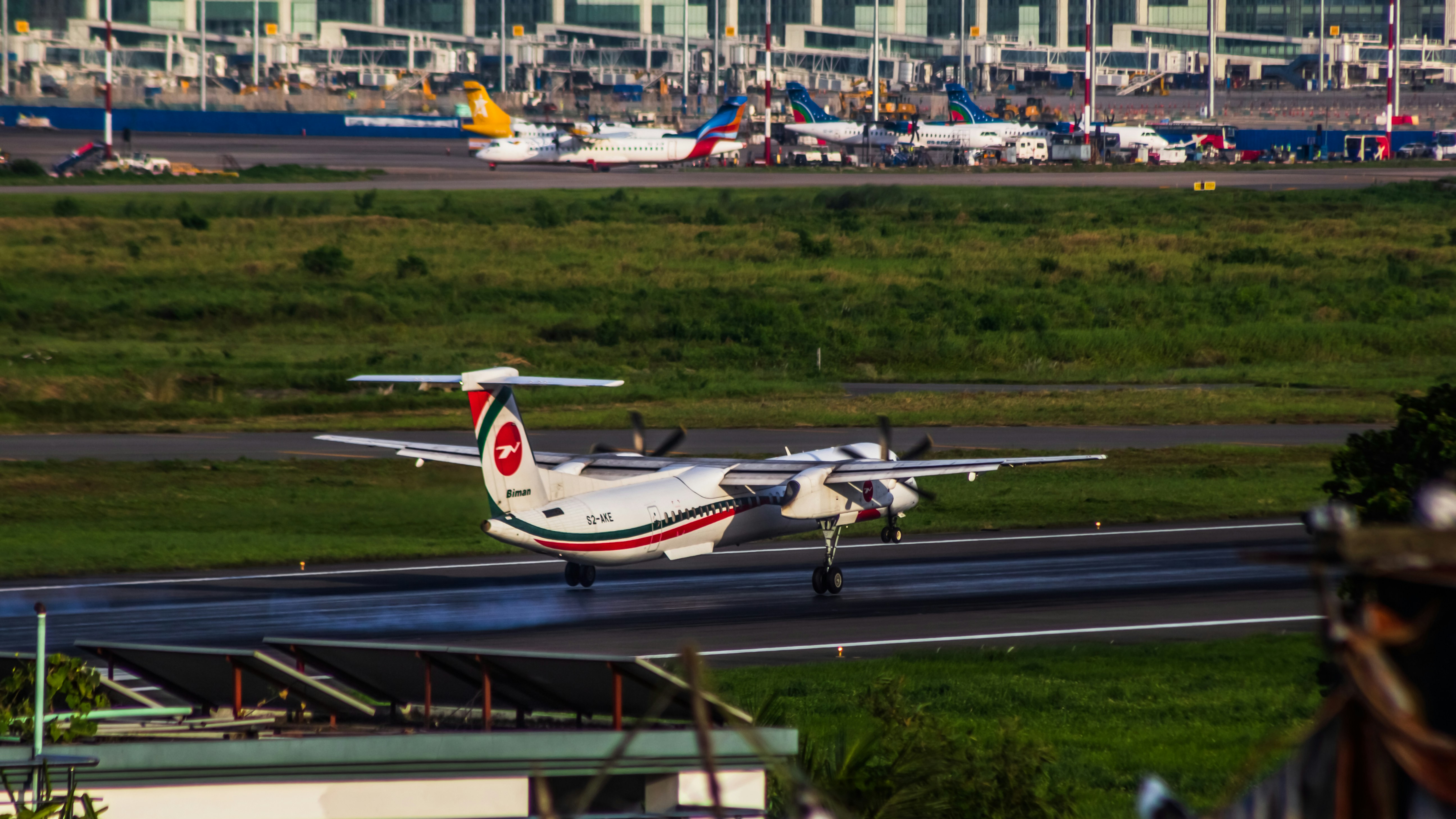 An airplane on the runway at an airport, Akaash Tori S2-AKE landing in VGHS airport.