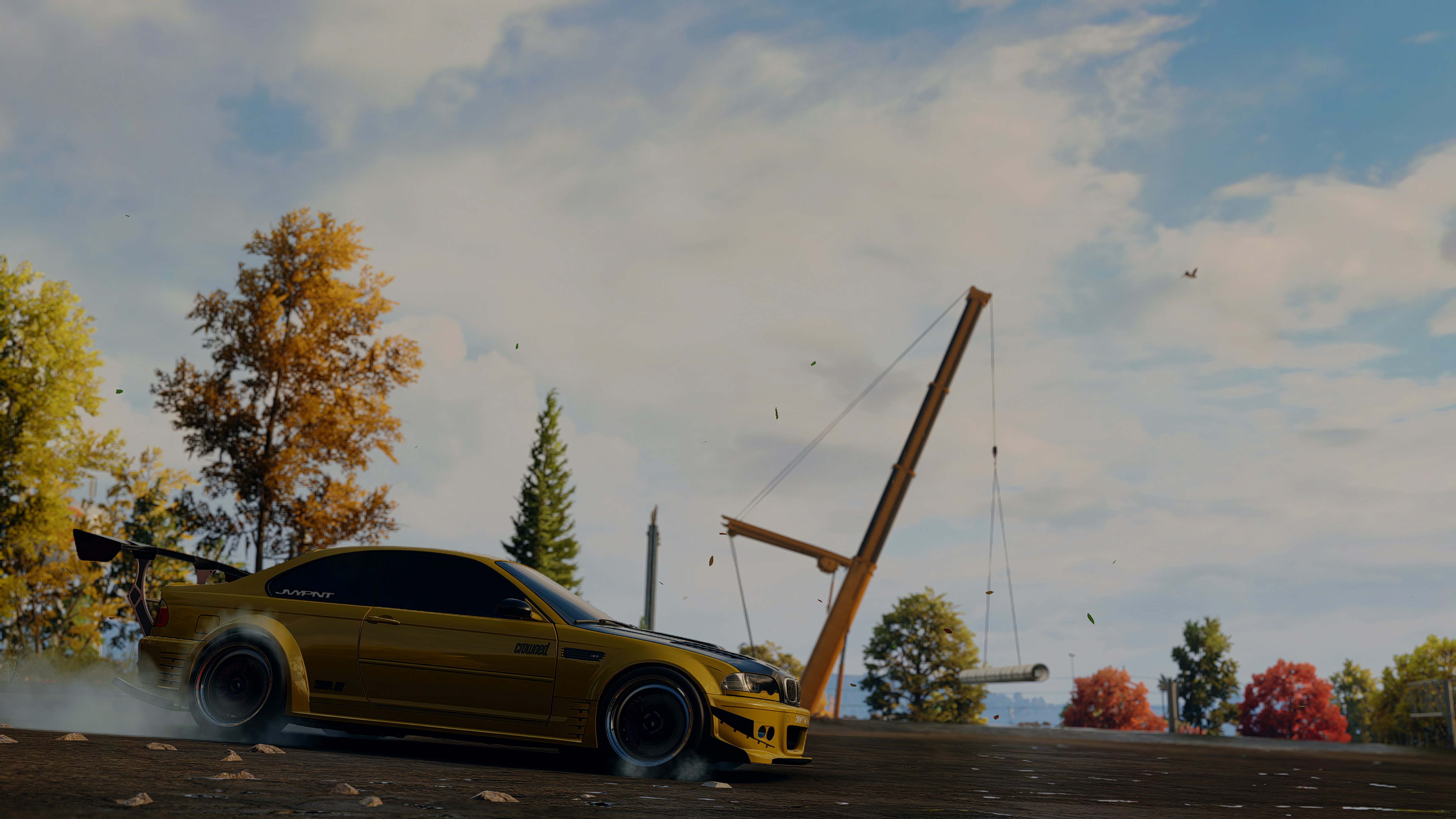 A yellow car with smoke coming out of it