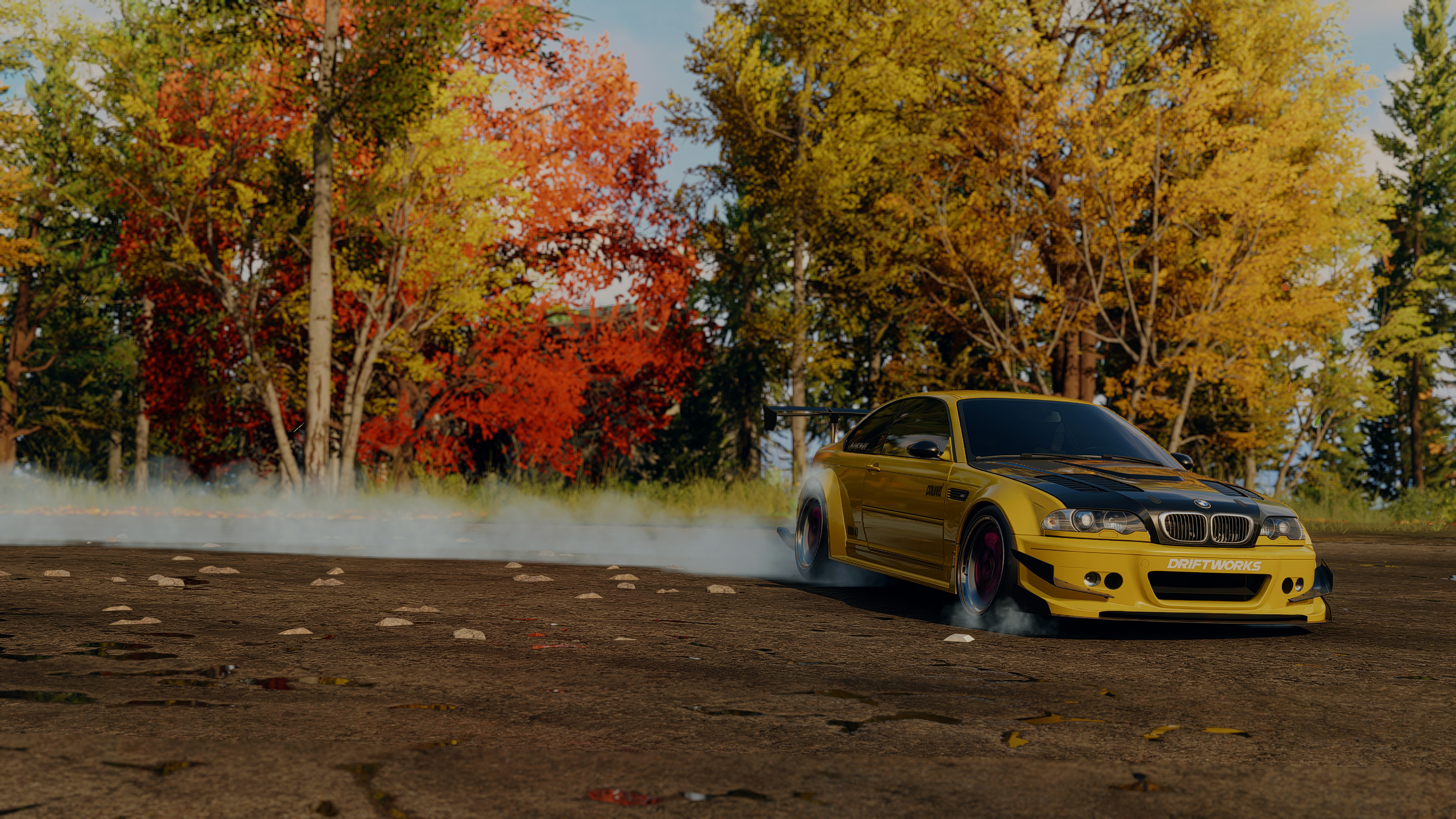 A yellow car with smoke coming out of it