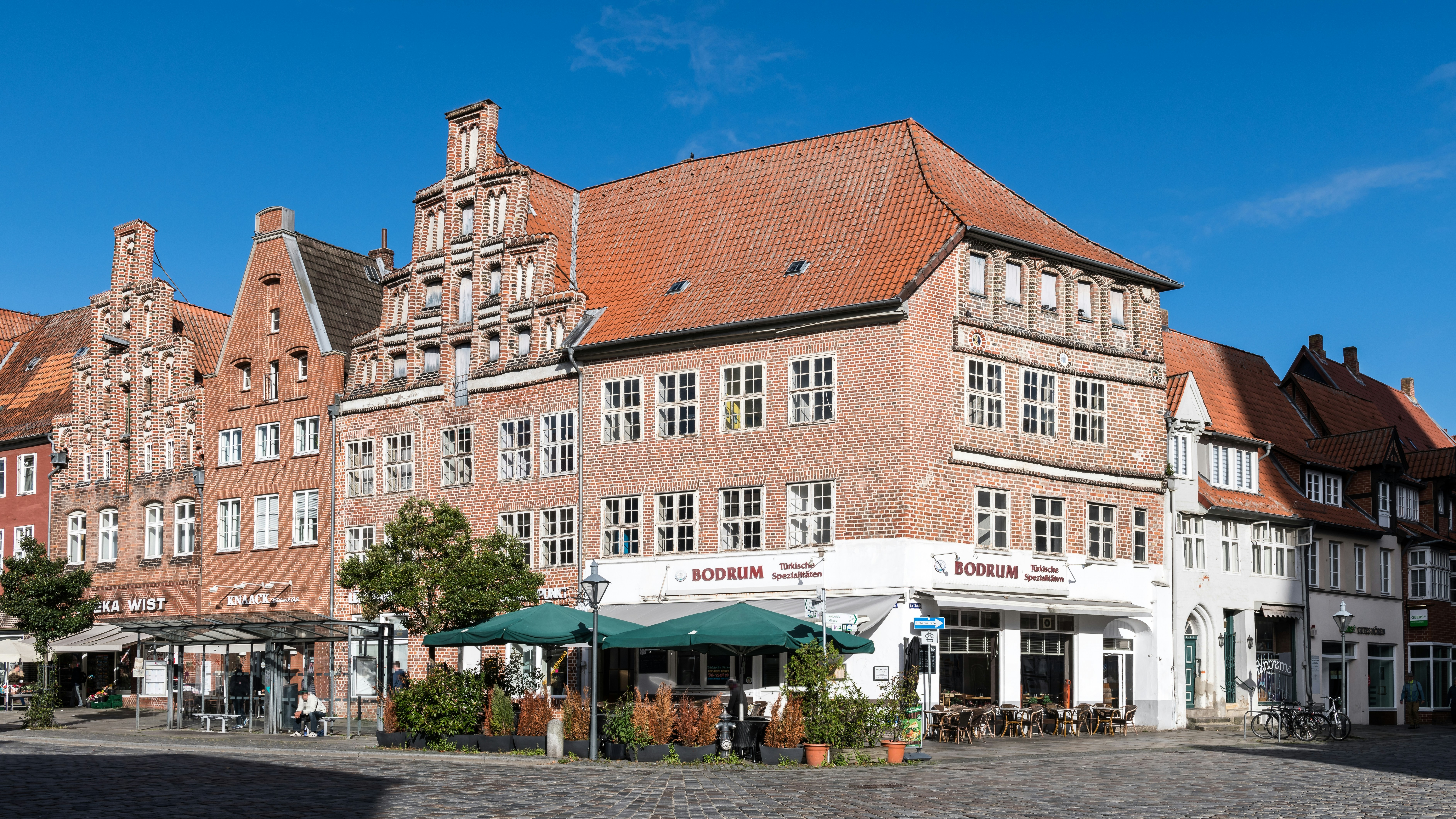 A group of buildings with a blue sky in the background