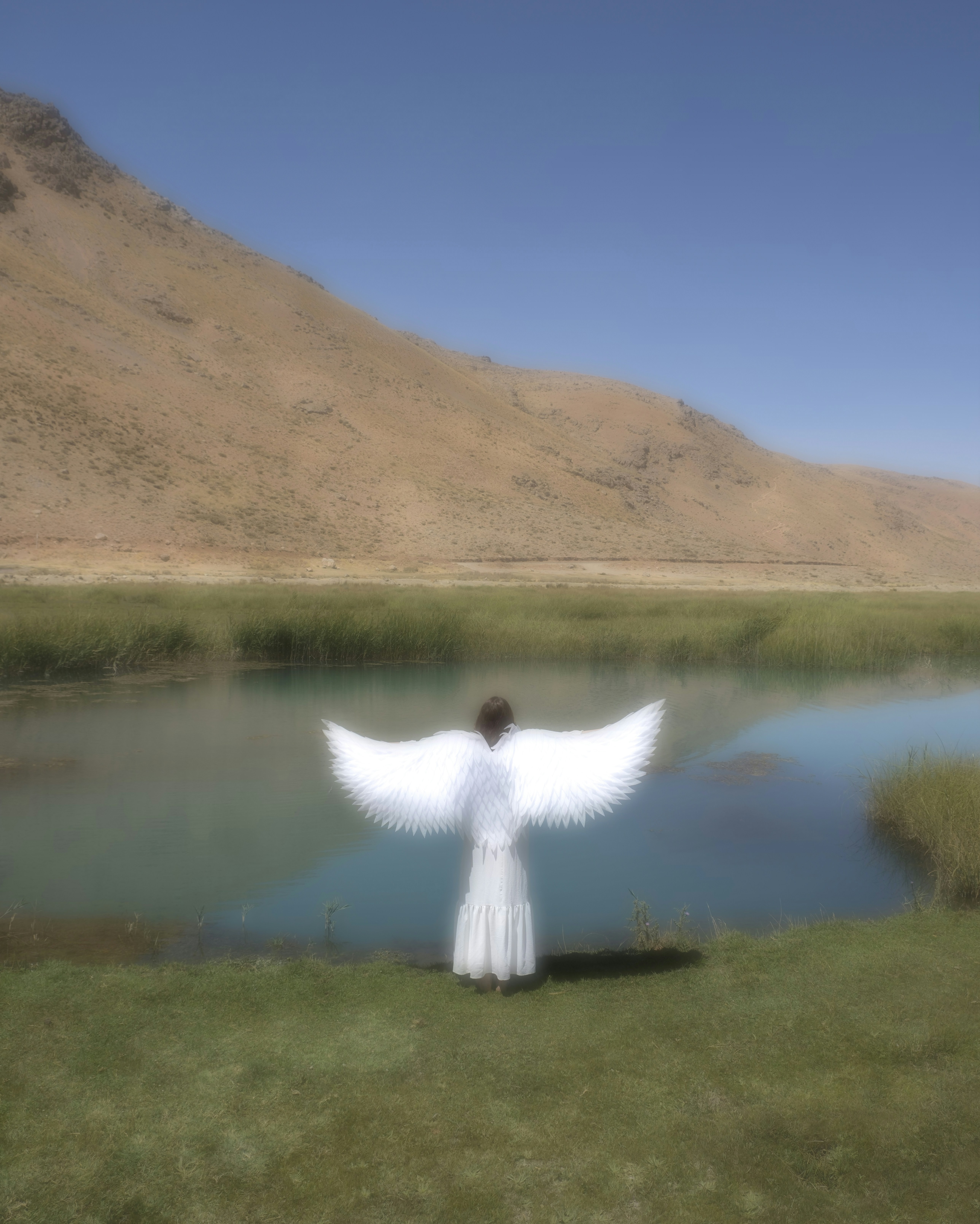 A person standing in front of a body of water