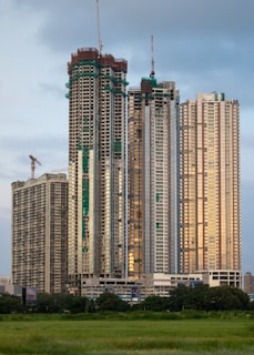 A very tall building sitting in the middle of a field