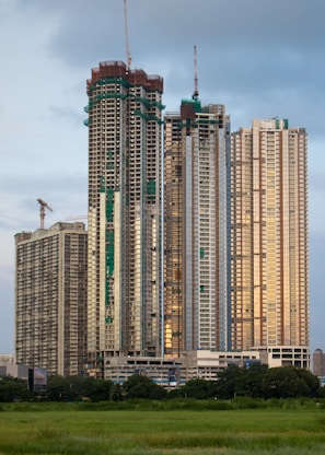 A very tall building sitting in the middle of a field