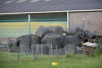 A pile of tires sitting in front of a building