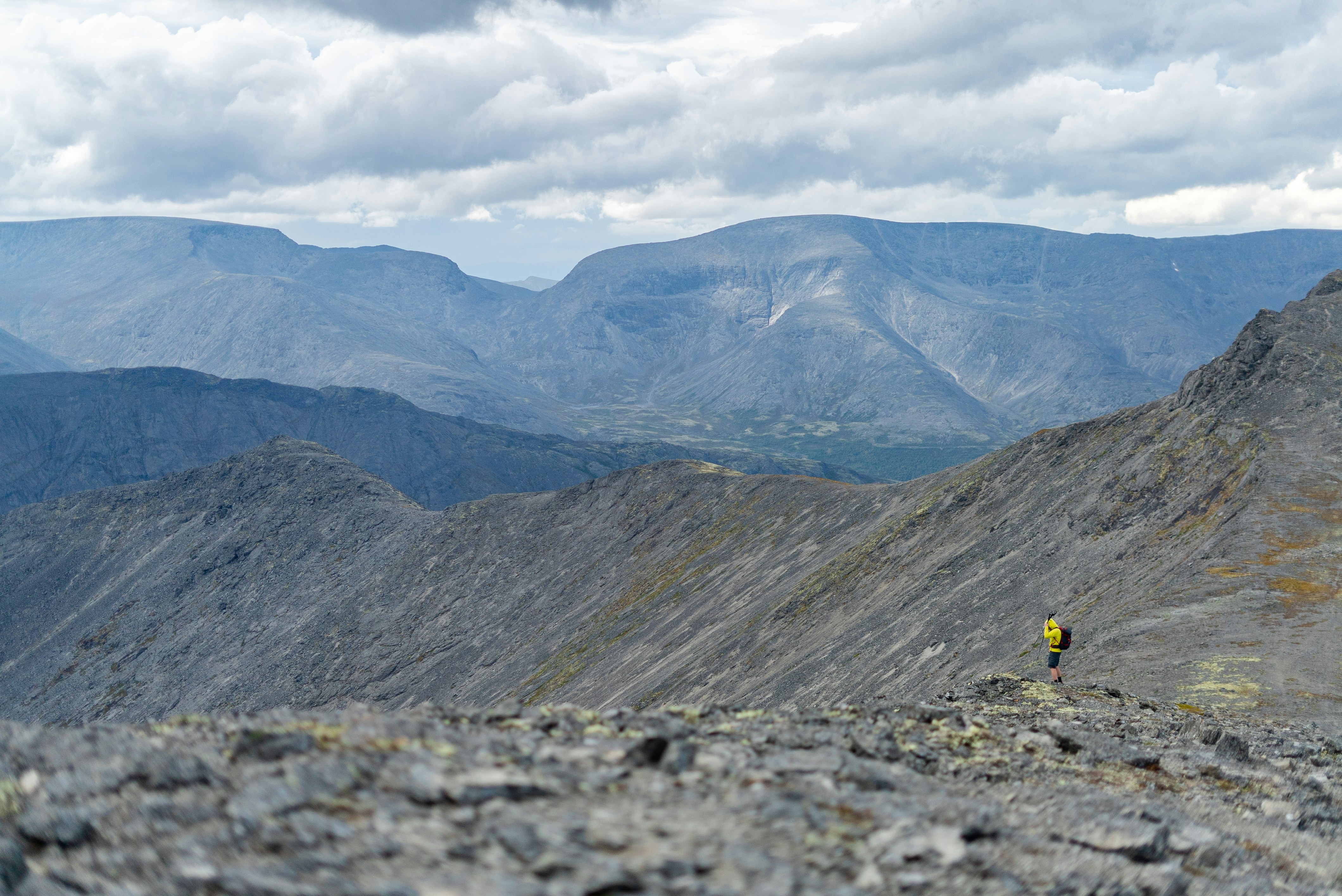 A man riding a bike on top of a mountain