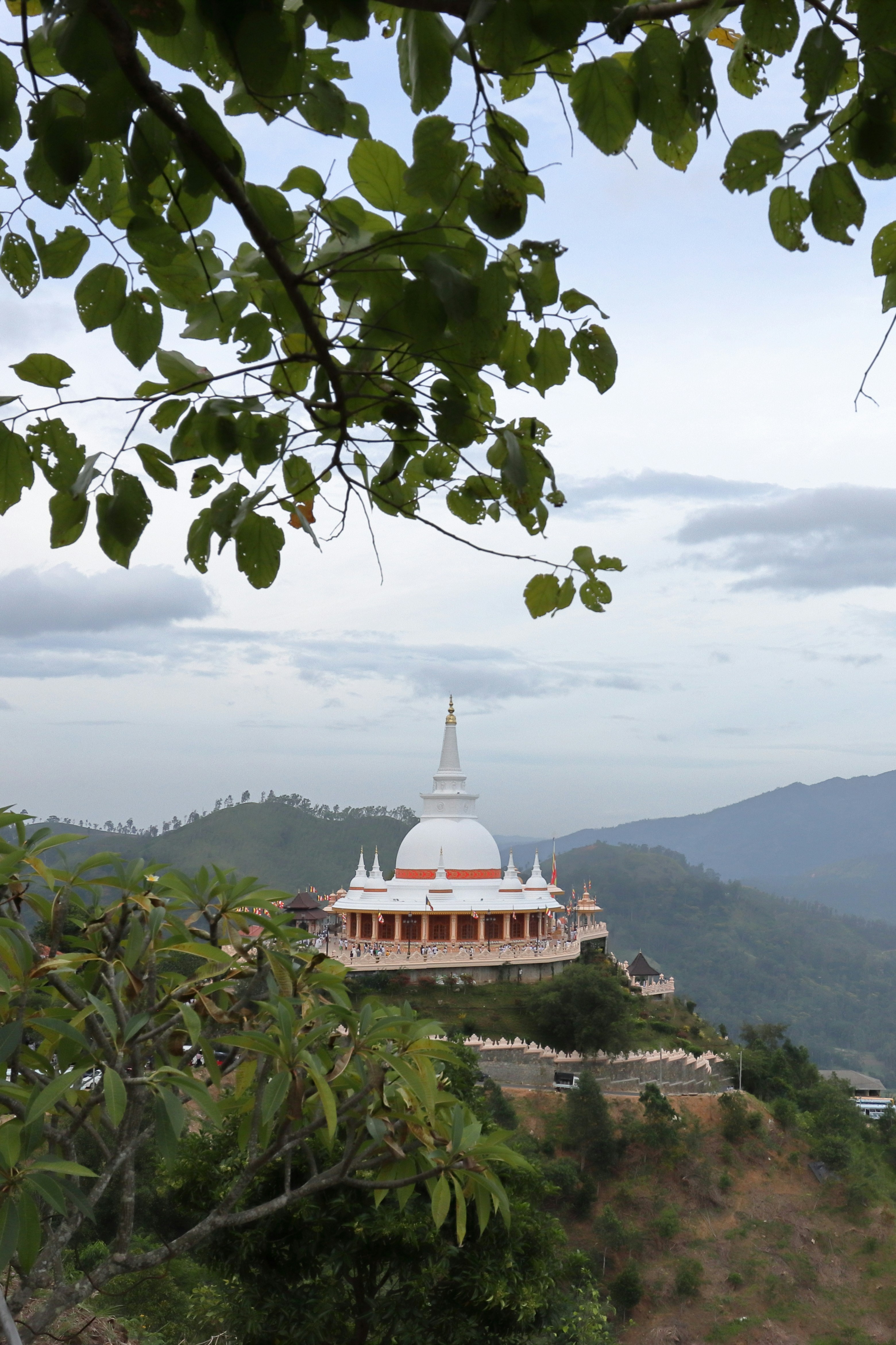 A view of a white building on a hill