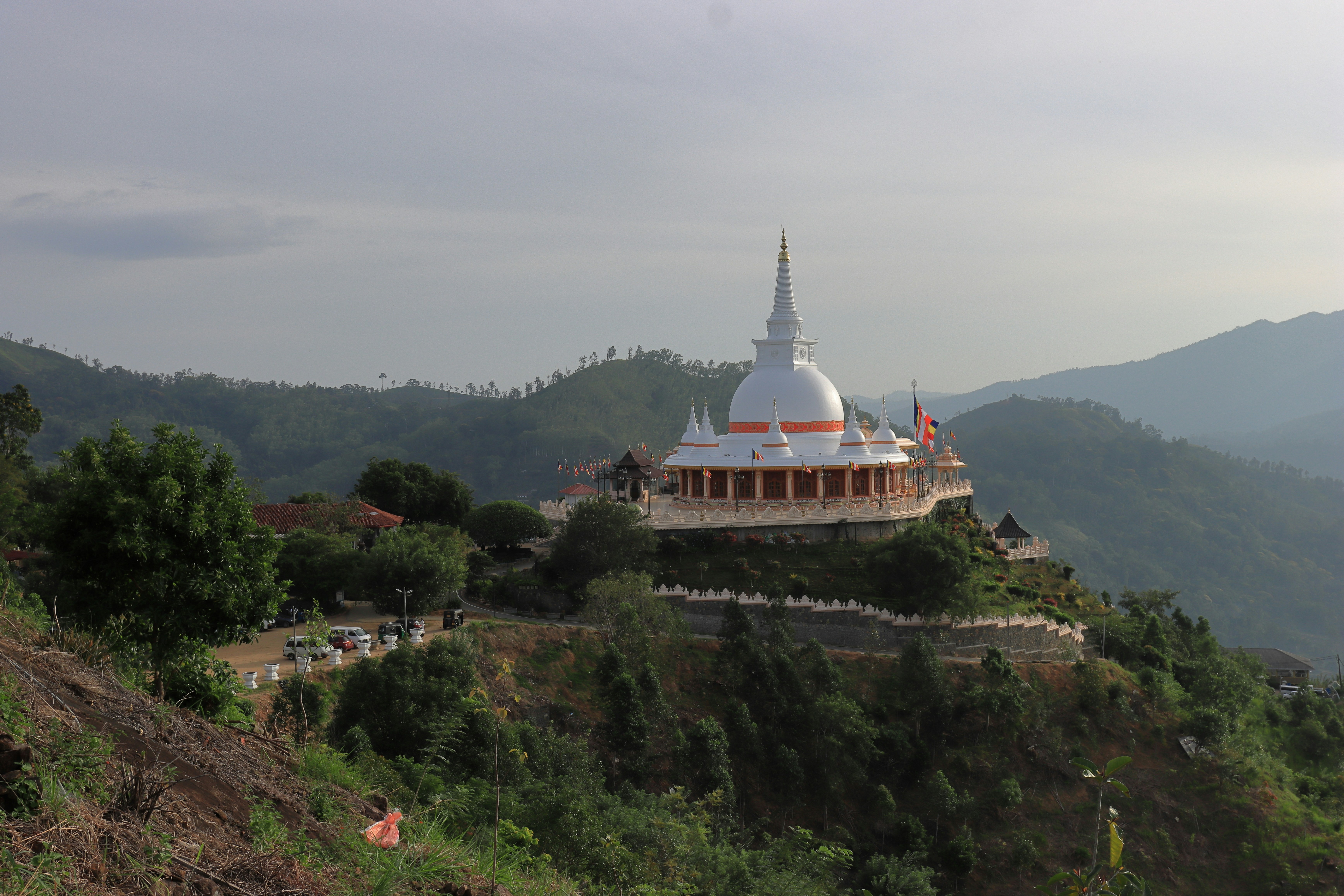 A large white building on top of a hill