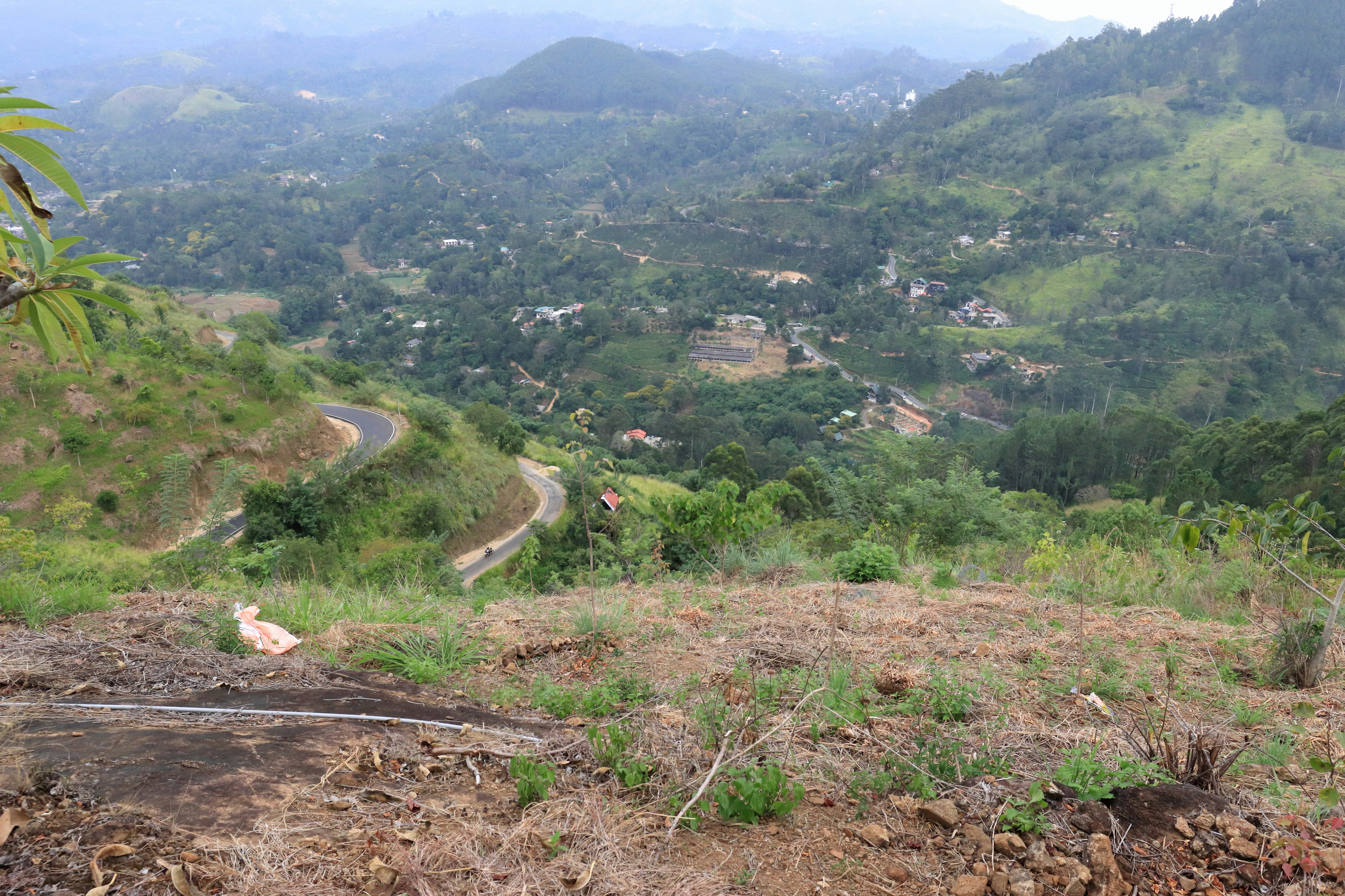 A view of a dirt road in the mountains