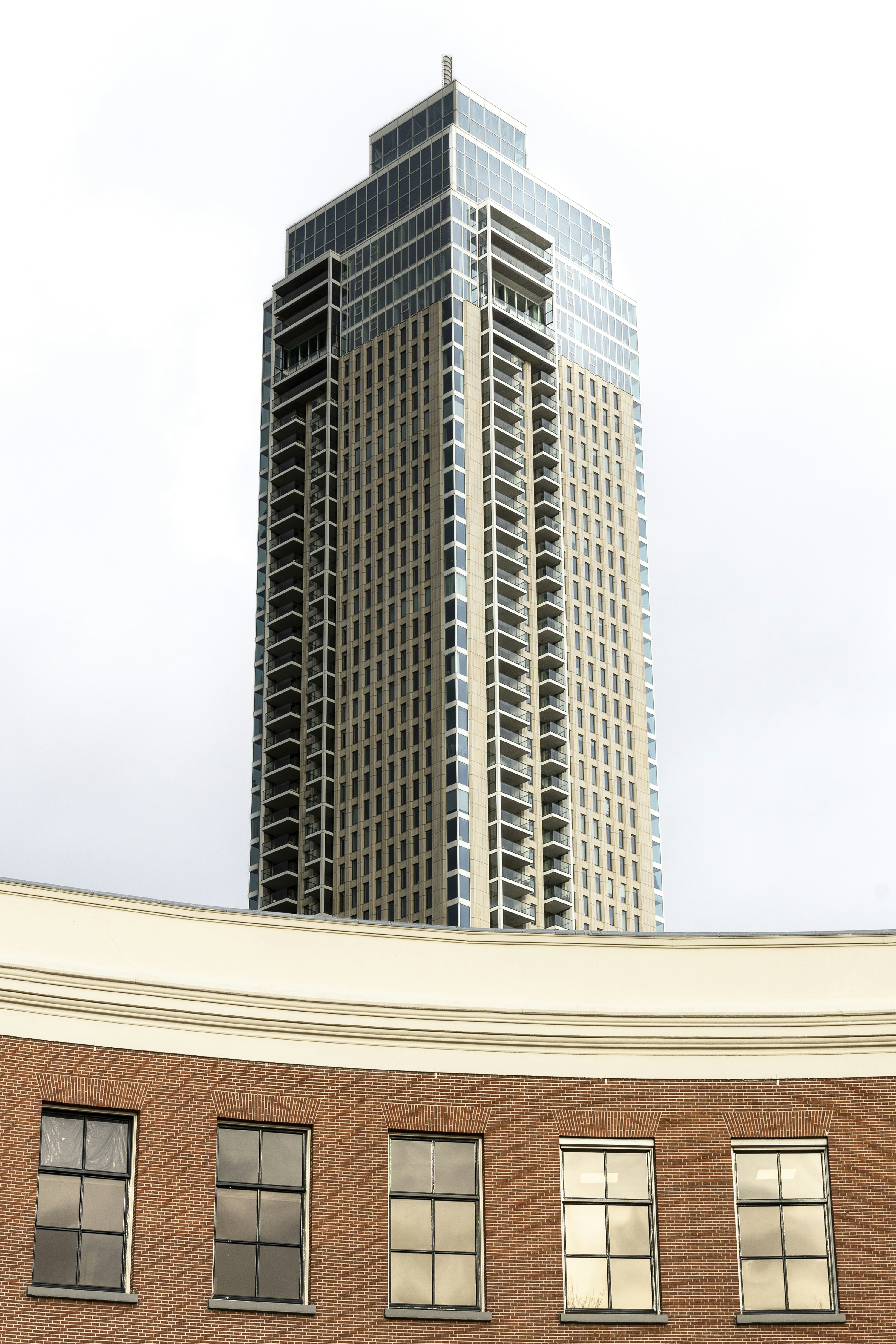 A tall building sitting next to a tall brick building