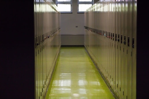 A long hallway in a building with yellow floors
