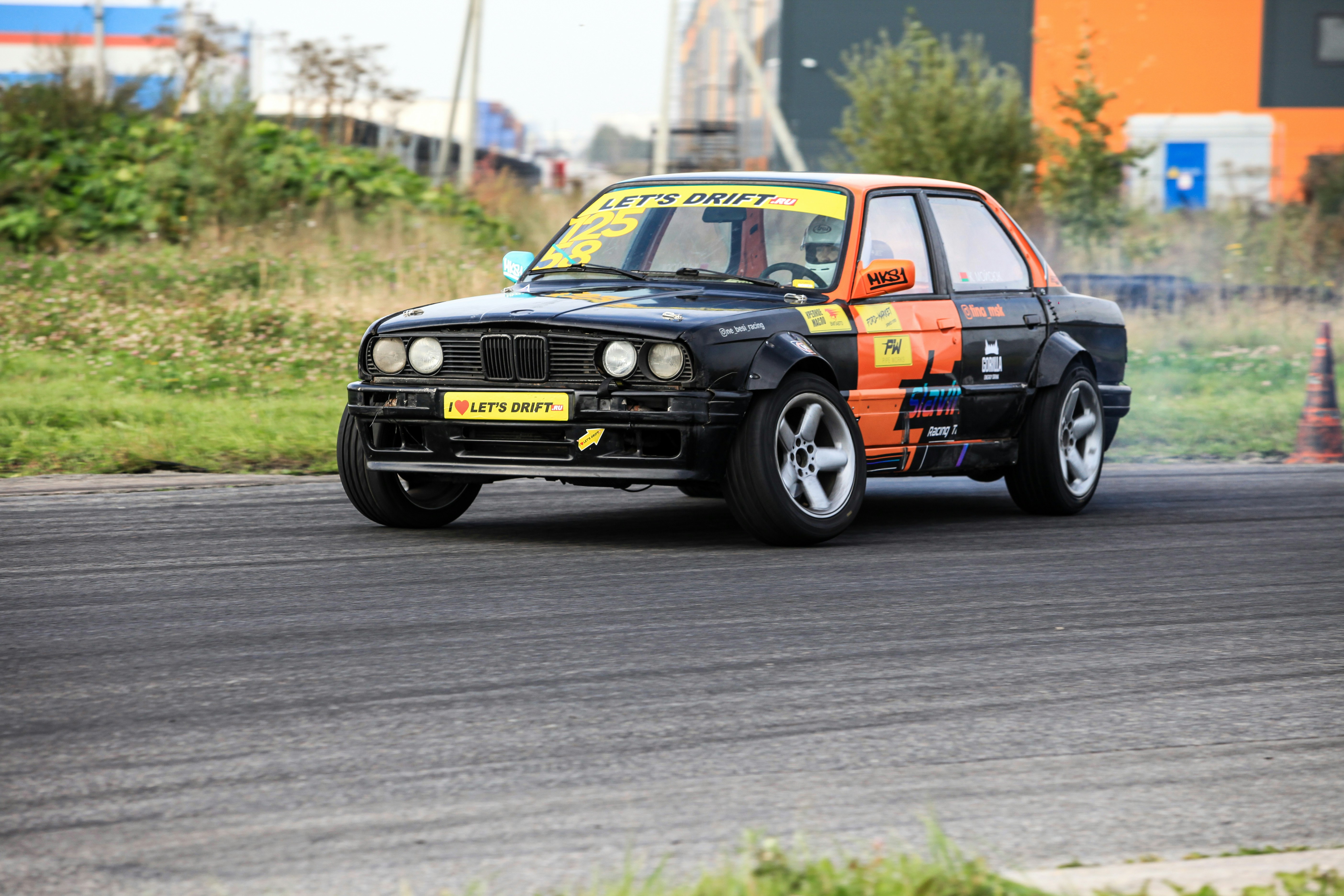 A small car driving down a race track