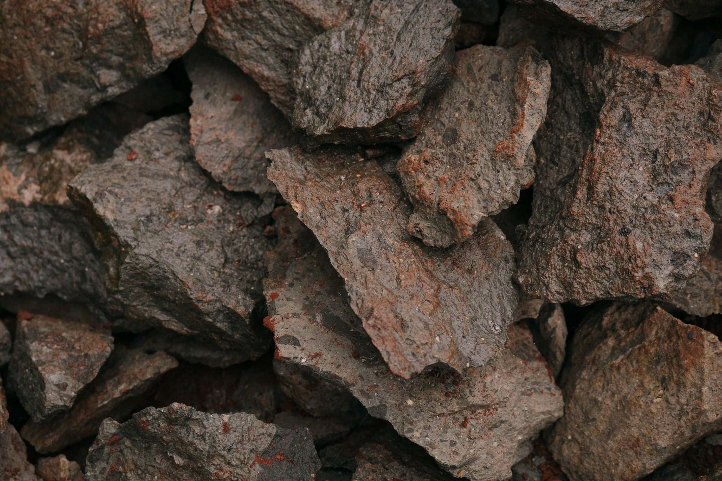A pile of brown rocks sitting next to each other