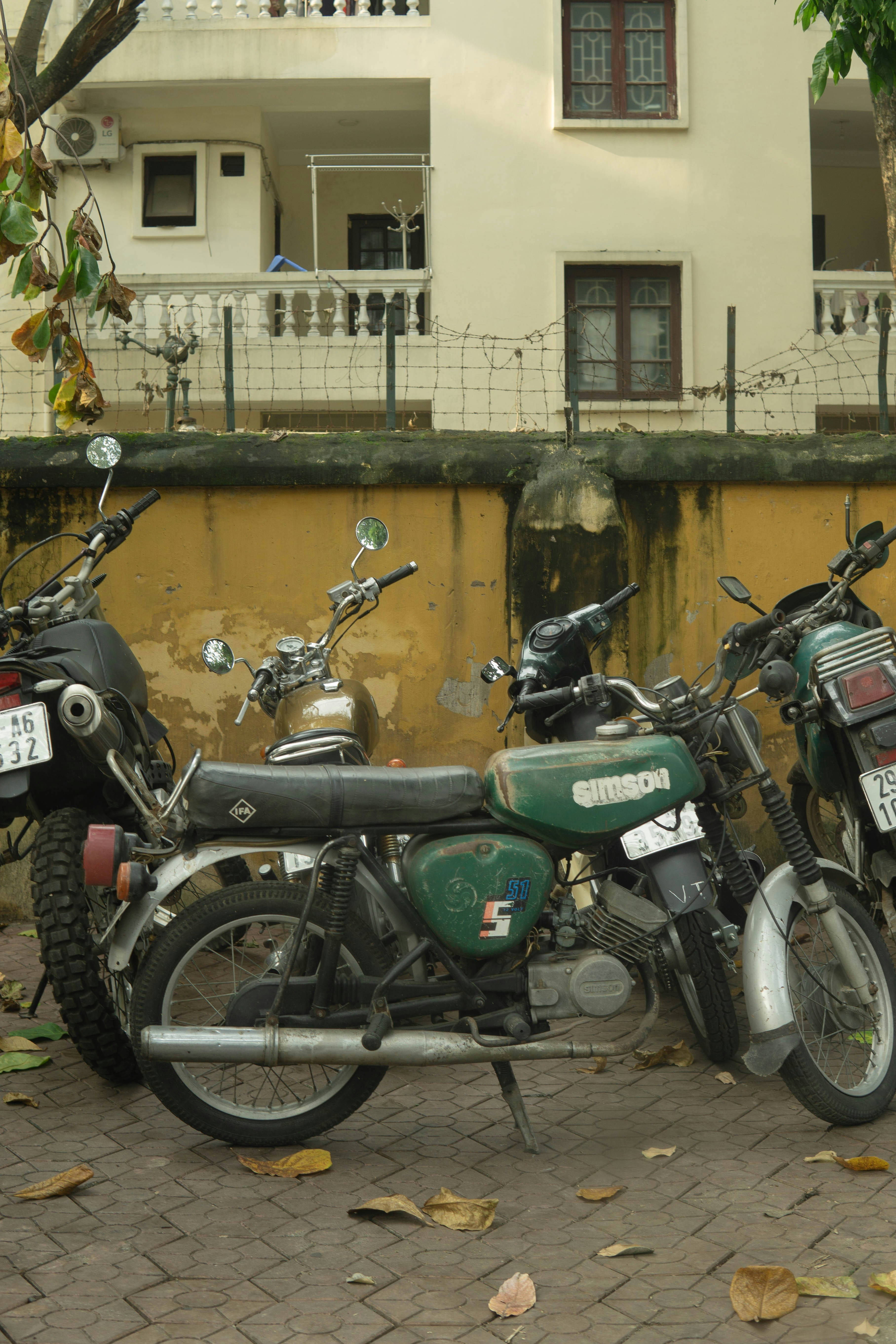 A couple of motorcycles parked next to each other
