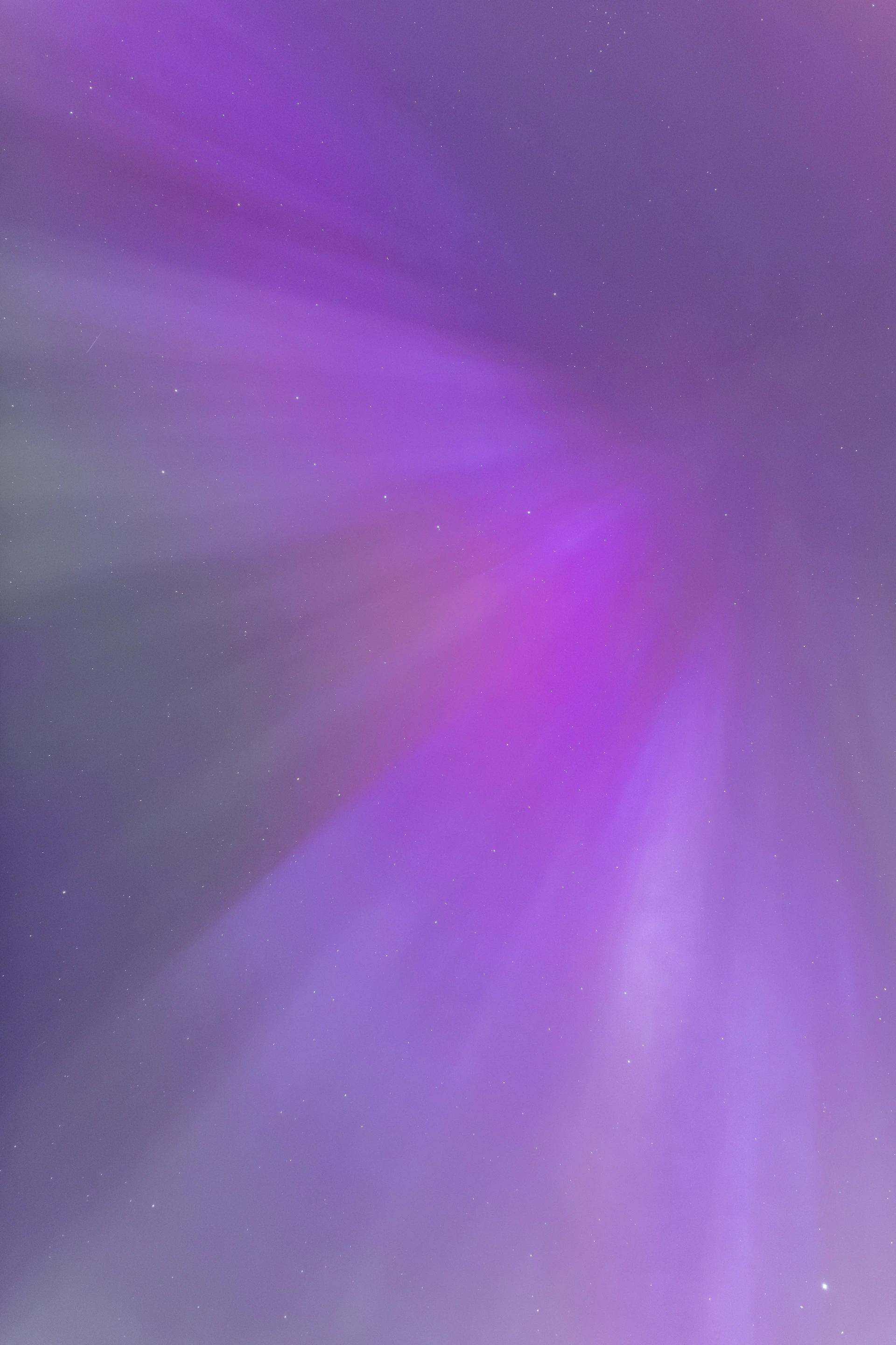 A blurry image of a purple and white background