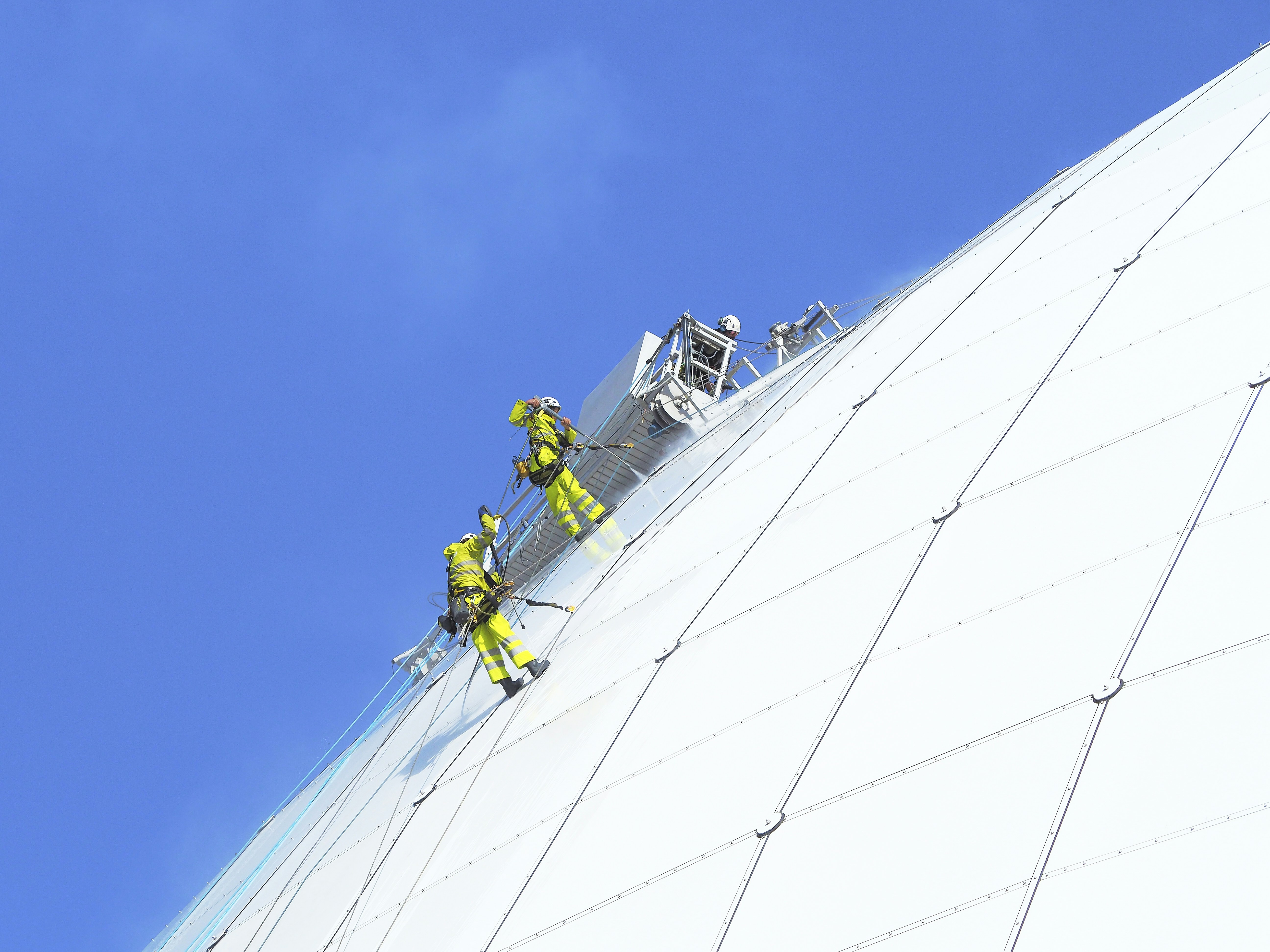 A group of people climbing up the side of a building