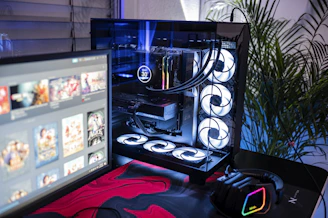 A desktop computer with a large screen and a mouse