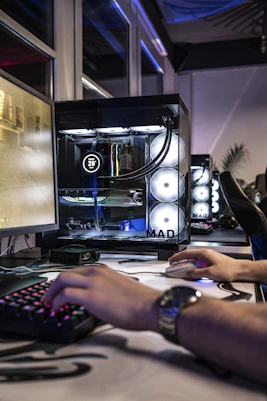 A man is typing on a computer keyboard