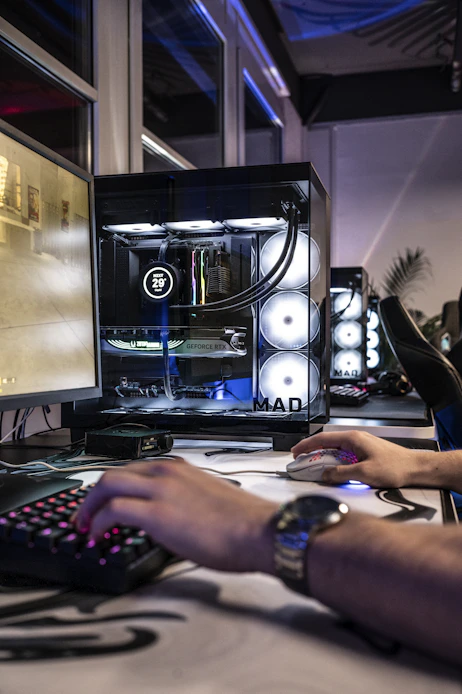 A man is typing on a computer keyboard
