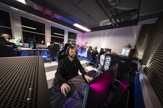 A man sitting in front of a laptop computer