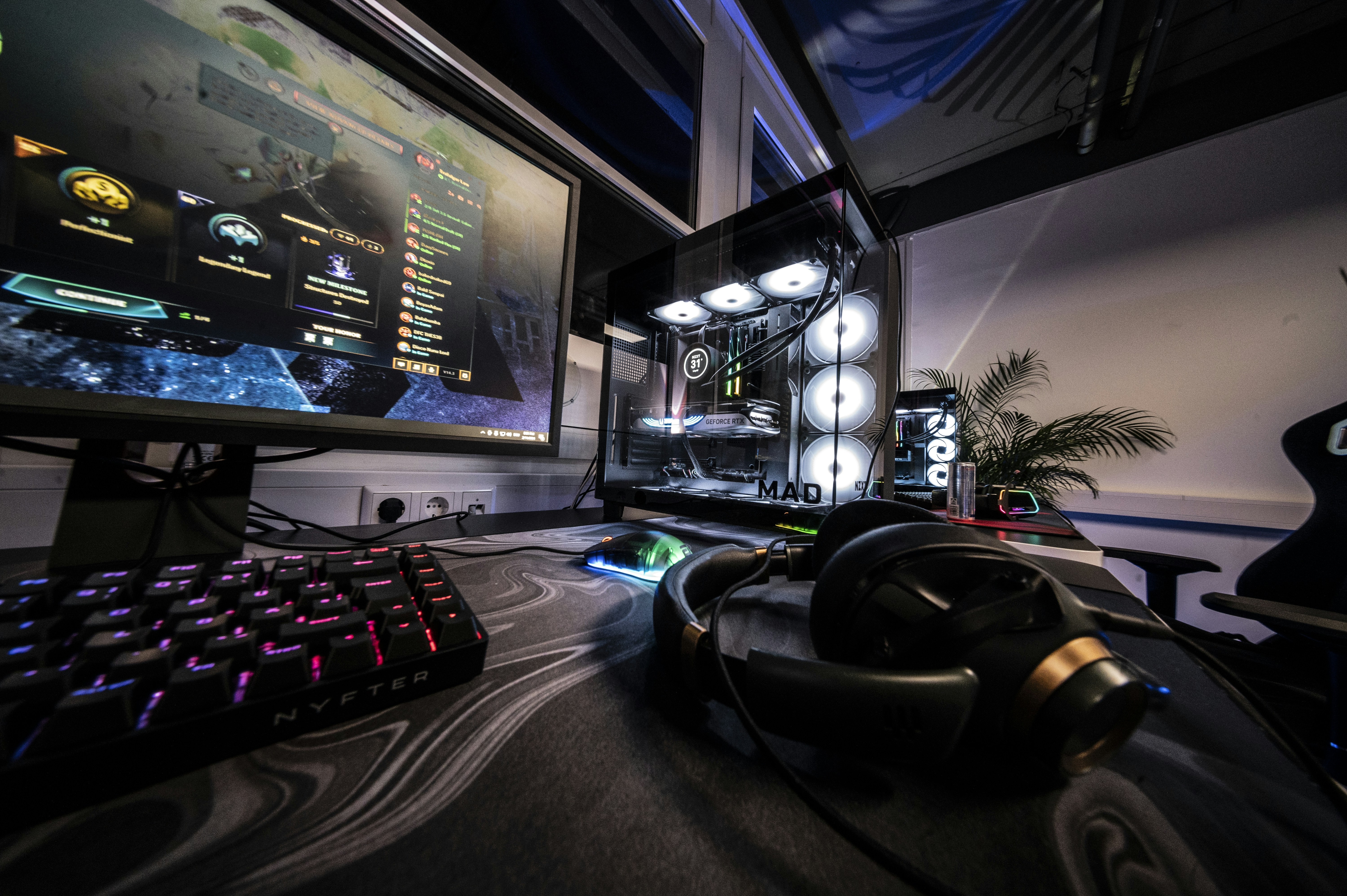 A computer desk with a keyboard, mouse and monitor