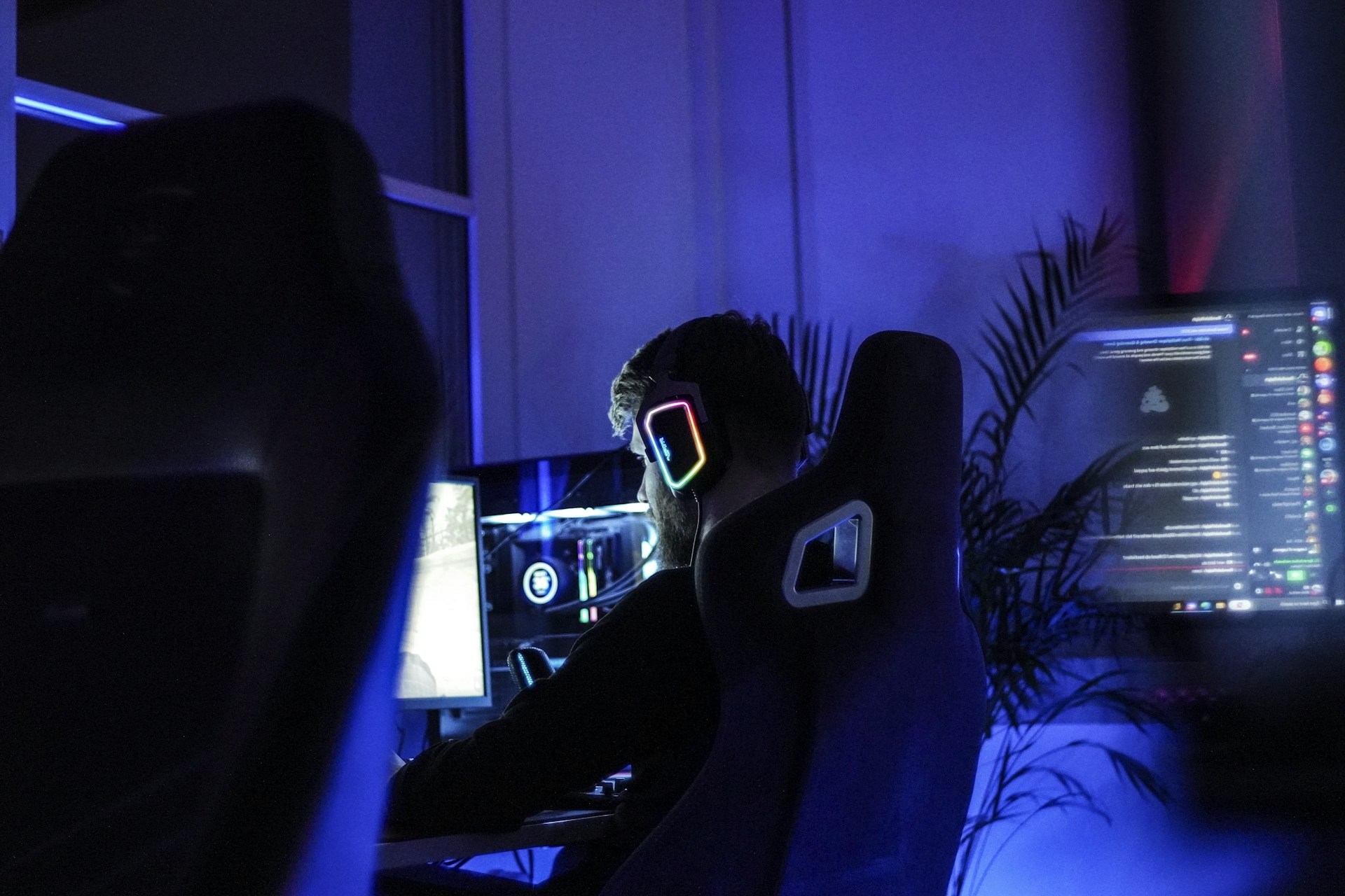 A man sitting in front of a computer monitor