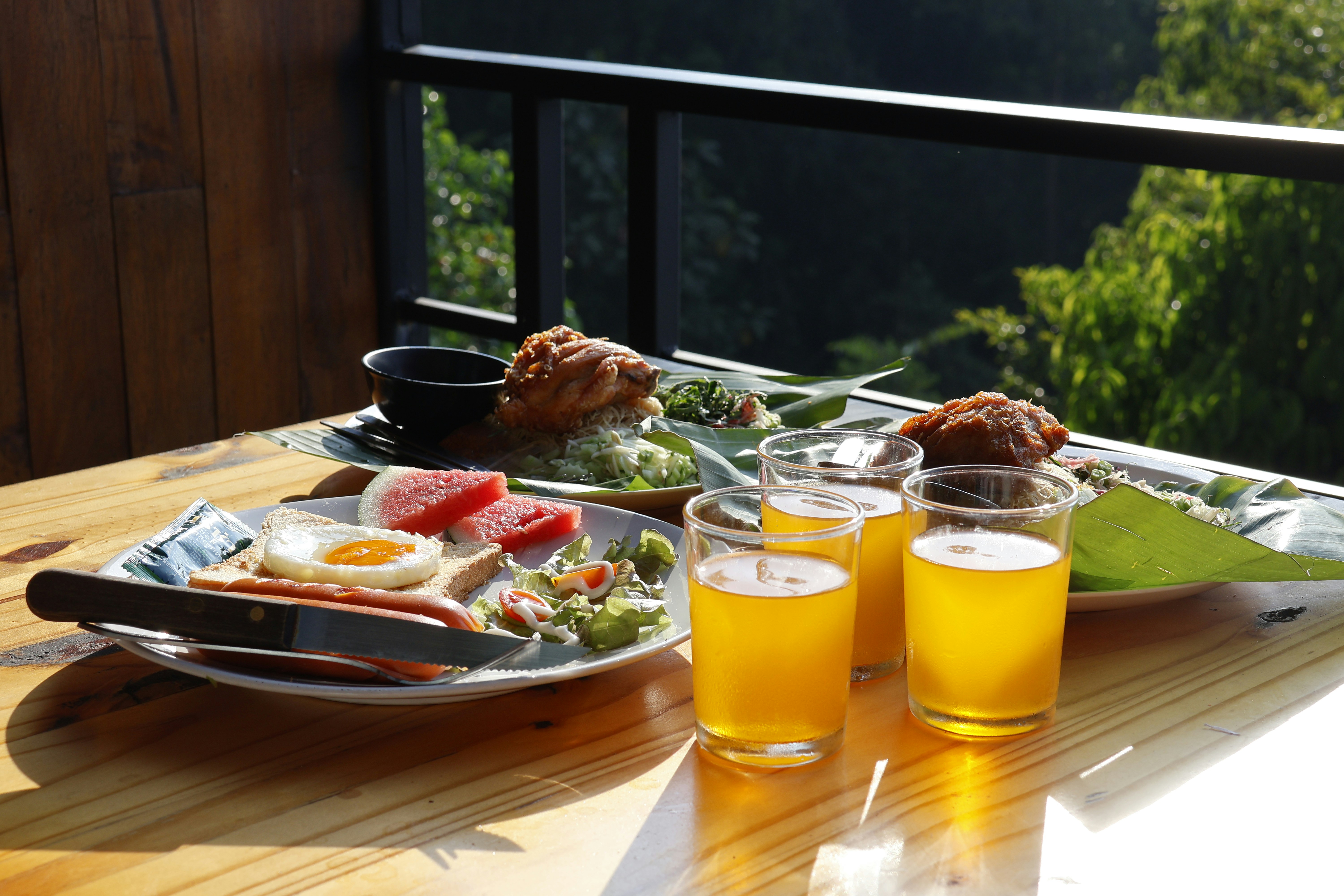 brunch spread with mimosas, pancakes, and city skyline in the background - Rooftop terrace Chicago