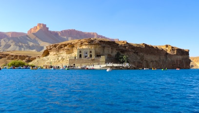 A large body of water with a mountain in the background