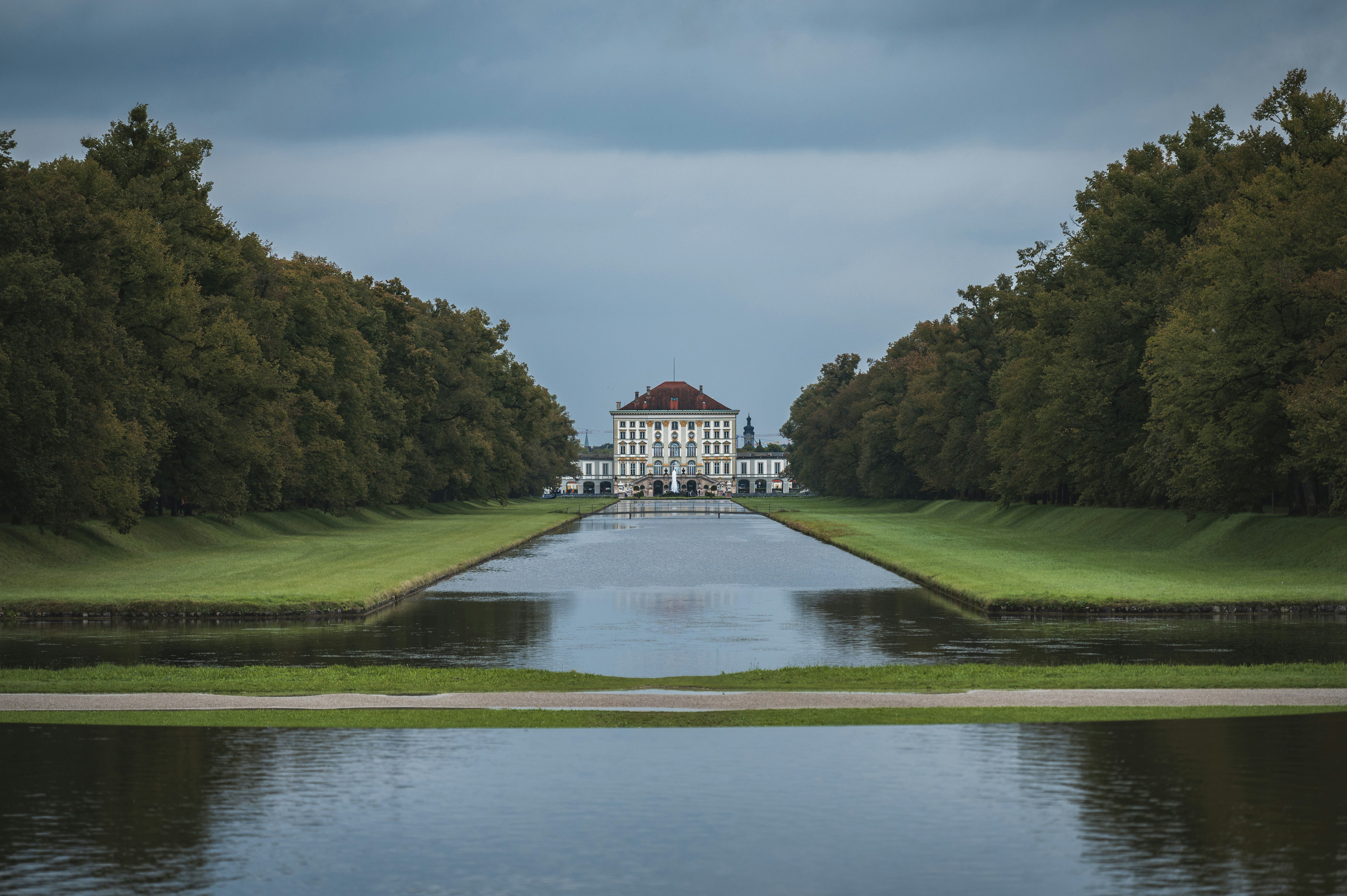 A view of a building from across a pond