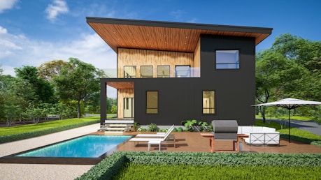 A modern house with a pool in front of it