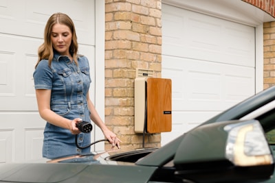 A woman is standing next to a car