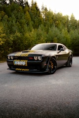 A black sports car parked on the side of the road
