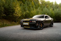 A black sports car parked on the side of the road
