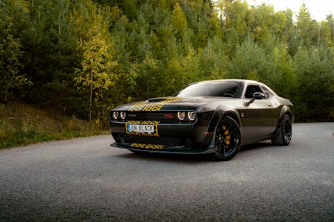 A black sports car parked on the side of the road