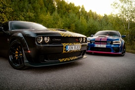A couple of cars parked on the side of a road