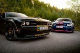 A couple of cars parked on the side of a road
