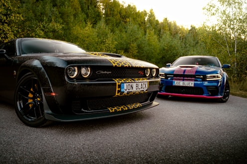 A couple of cars parked on the side of a road