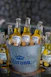 A bucket full of corona beer sitting on a table