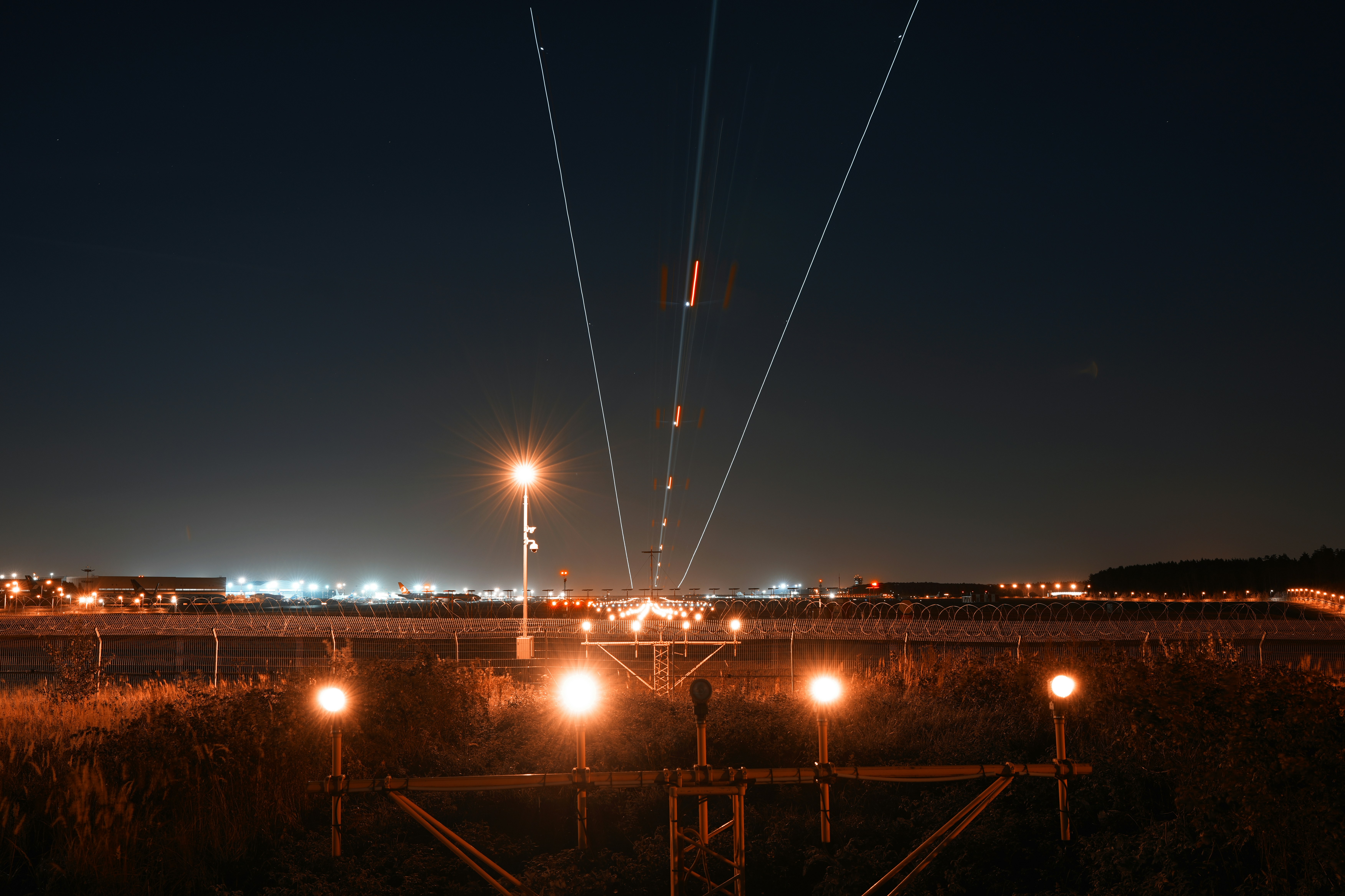 A train traveling through a rural countryside at night