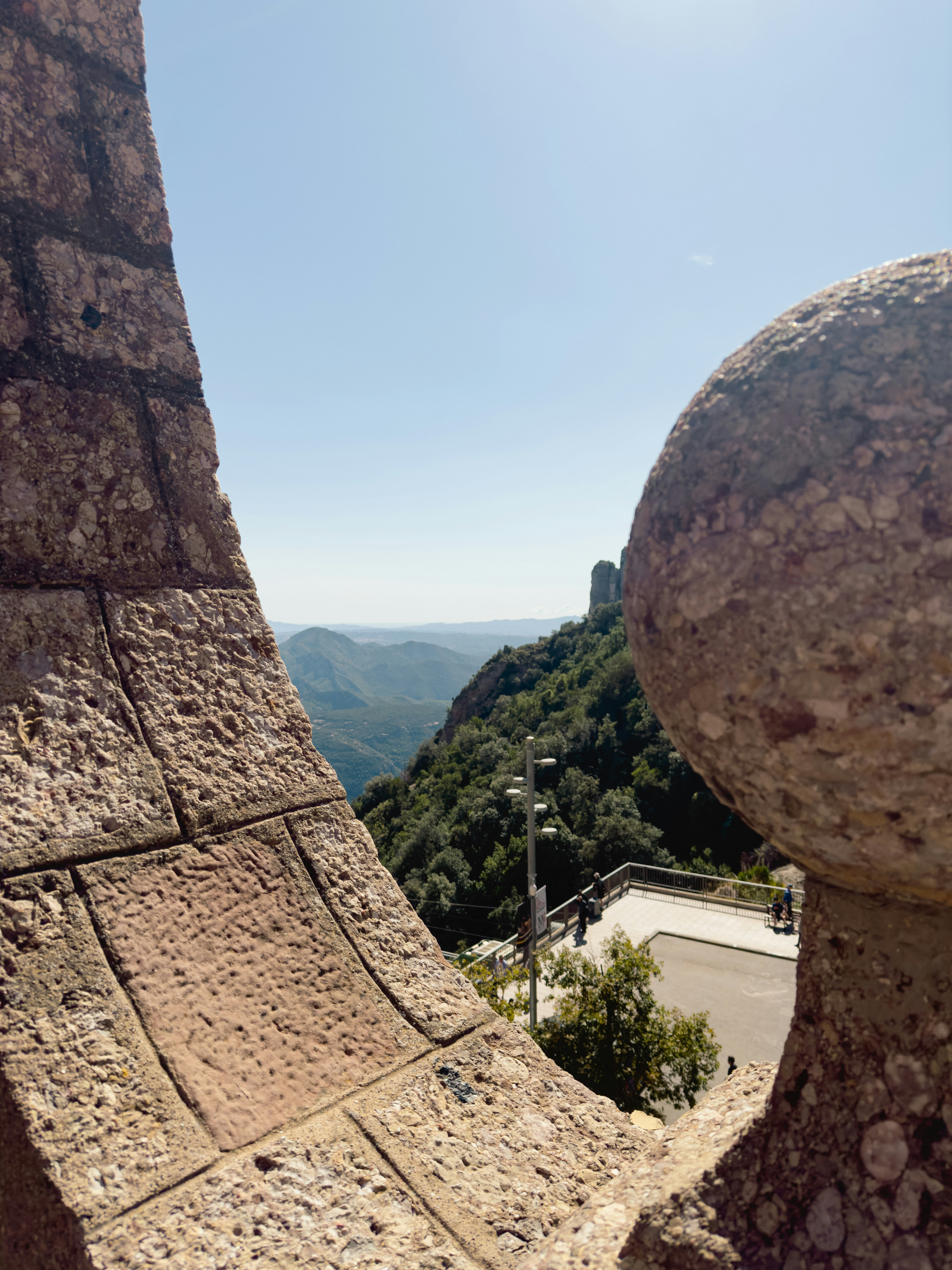 A stone structure with a view of a valley