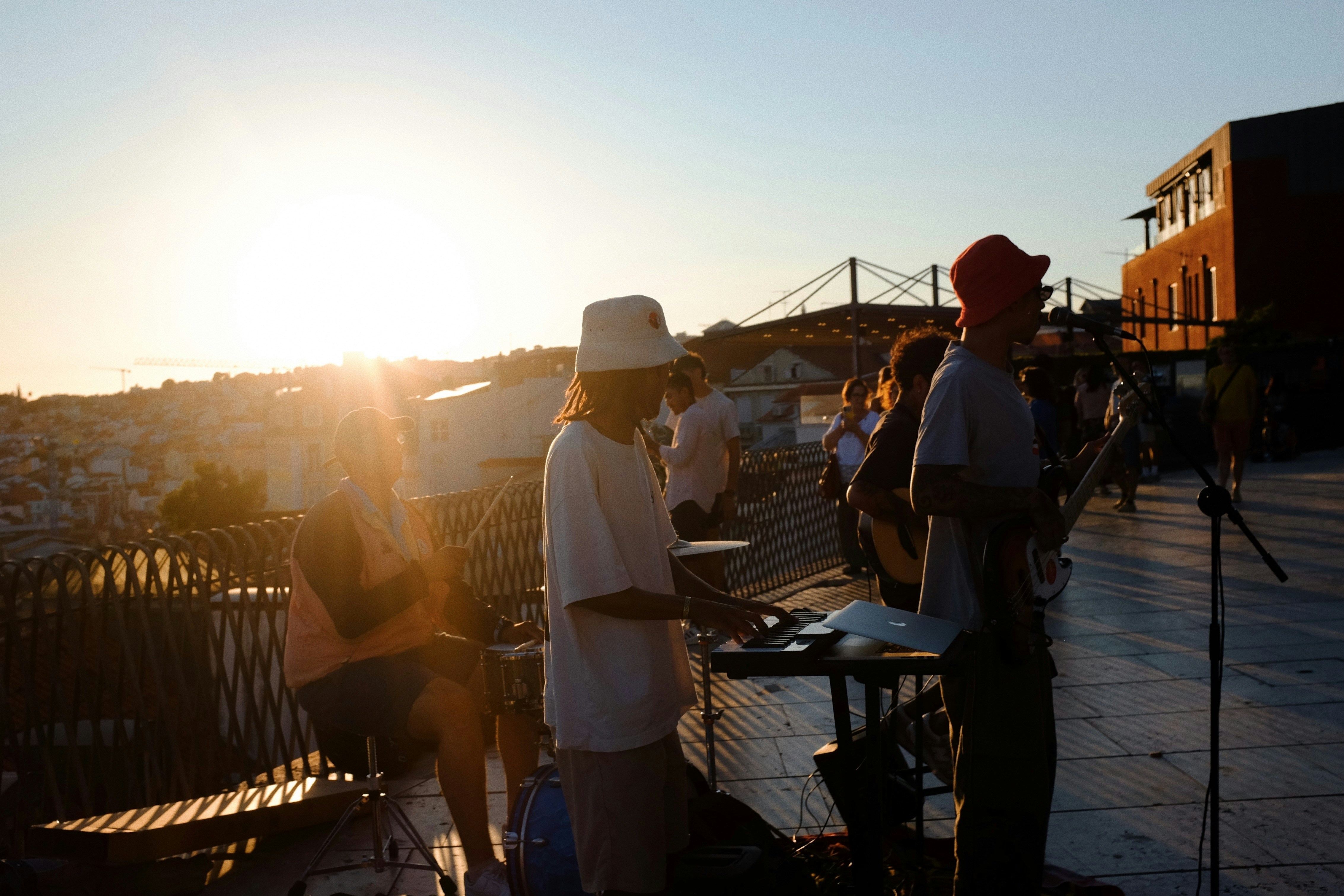 A group of people standing on top of a roof