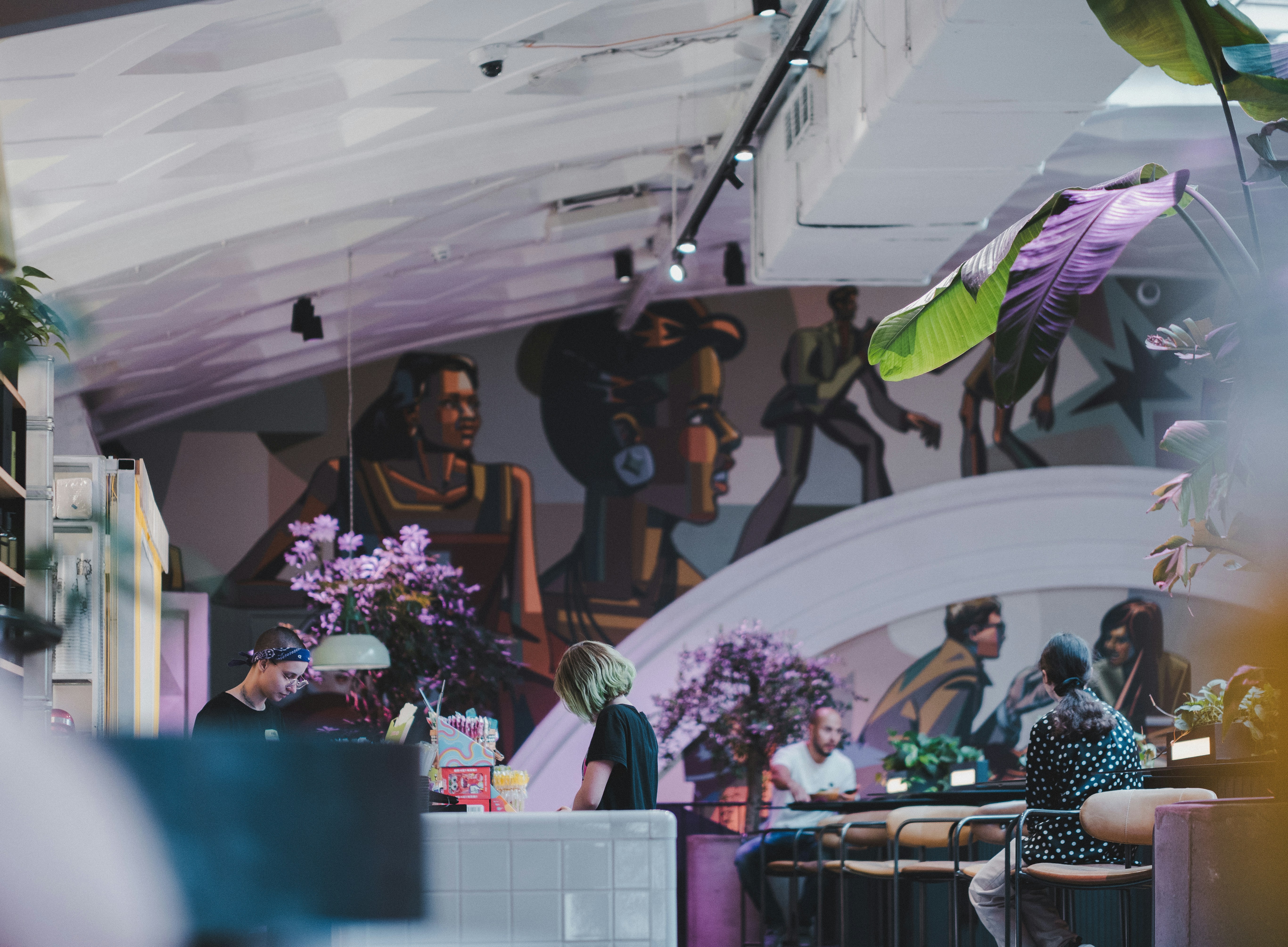 A group of people sitting at a table in a room