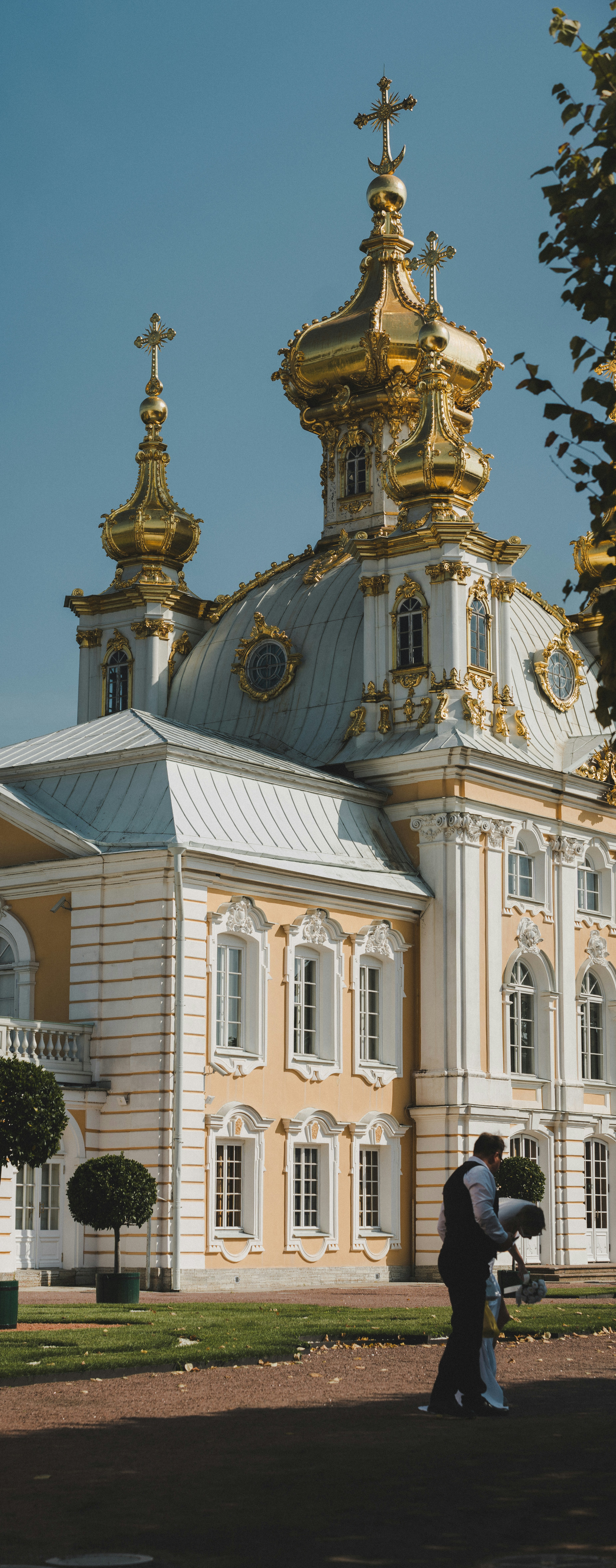 Two people standing in front of a large building