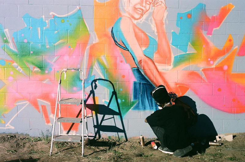 Artist at work on a mural